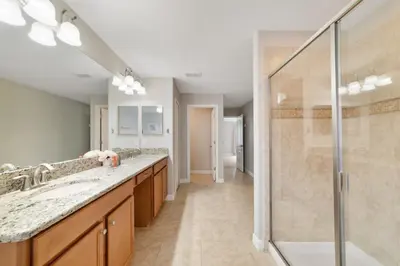 a bathroom with two sinks and a shower at Disney Staycation Pool, Fun Resort Access in Kissimmee