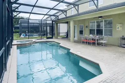 a swimming pool in the middle of a house at Bright Resort Home Pool Near Disney in Orlando