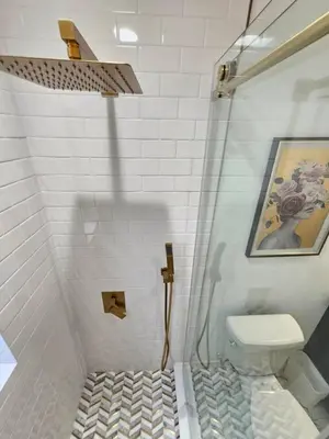 a bathroom with a shower with a toilet in it at Stylish Duplex walkTO Lake Eola Orlando. Sleeps 8 in Orlando