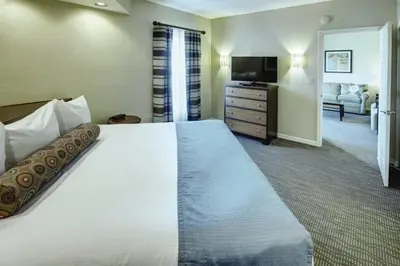 a hotel room with a large bed and a television at Wyndham Star Island Resort-1BR- Apartment with Resort Access in Kissimmee