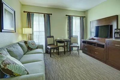a living room with a couch and a flat screen tv at Wyndham Star Island Resort-1BR- Apartment with Resort Access in Kissimmee