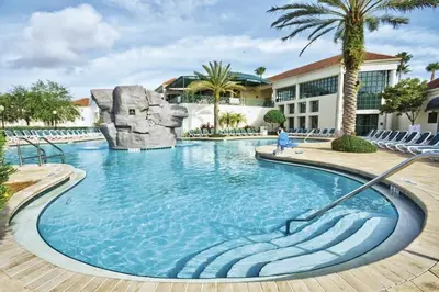 a pool at a resort with a water slide at Wyndham Star Island Resort-2BR- Apartment with Resort Access in Kissimmee