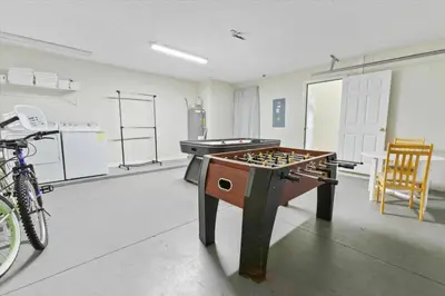 a room with a ping pong table in a room at Elegant Emerald Island – Near Disney in Kissimmee