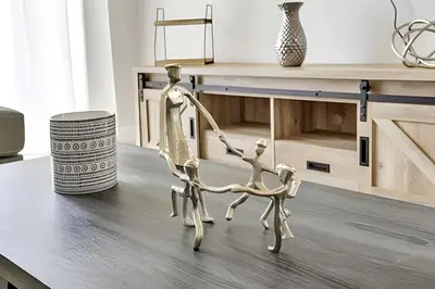 a metal dog on a table in a living room at Refúgio 3Q no Windsor Palms Resort in Kissimmee