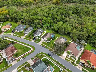 an aerial view of a house with a road at 15 Mins Disneyworld Private Pool & Game Room in Kissimmee