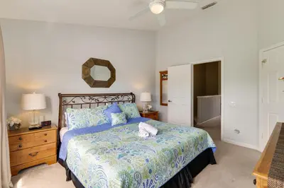a bedroom with a bed and a dresser and a mirror at Family-Friendly Resort Getaway 5 Mi to Disney! in Kissimmee