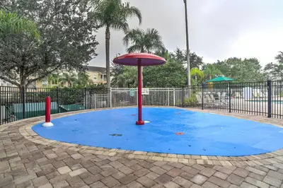 a playground with a frisbee on a blue ground at Family-Friendly Resort Getaway 5 Mi to Disney! in Kissimmee