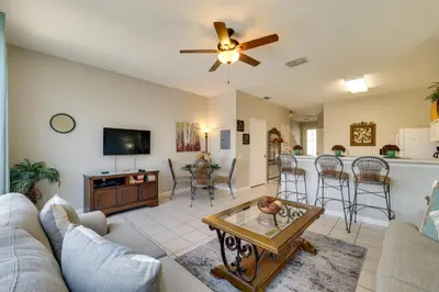 a living room with a couch and a table at Pool and Resort Perks Family Retreat Near Disney! in Kissimmee