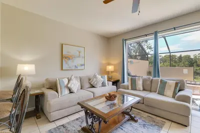 a living room with a couch and a table at Pool and Resort Perks Family Retreat Near Disney! in Kissimmee