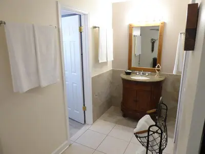 a bathroom with a sink and a mirror at Perfecto Mundo 3, Orlando Area 5BR-2BA-Outdoor Pool-Jacuzzi-Billiard in Orlando