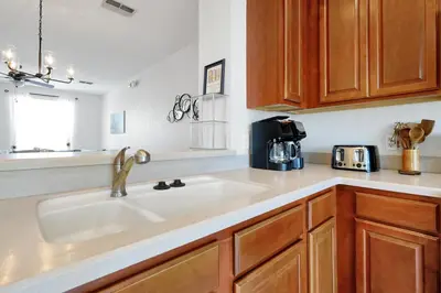 a kitchen with a sink and a counter top at Epic Universe Vacation Townhome, Vista Cay - 4035 in Orlando