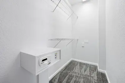 a white bathroom with a microwave on the wall at Epic Universe Vacation Townhome, Vista Cay - 4035 in Orlando