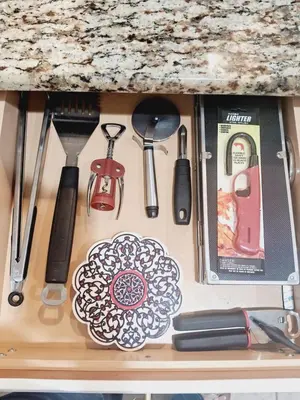 a drawer full of kitchen utensils on a counter at Villa Coco in Kissimmee