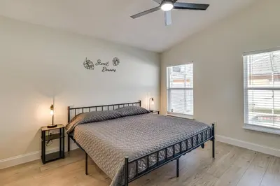 a bedroom with a bed and a ceiling fan at 10 Mi to Animal Kingdom Clermont Home with Pool! in Orlando