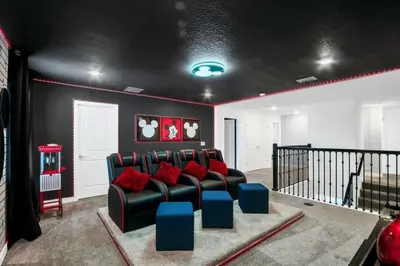 a living room with a couch and red pillows at Storey Lake Casa 9Q c Piscina, Cinema e Game Room in Kissimmee