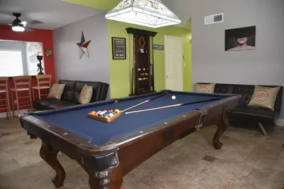 a living room with a pool table in it at Perfecto Mundo 2, Orlando Area 4BR-2B-Outdoor Pool-Jacuzzi-Billiard in Orlando