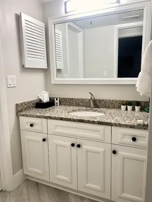 a bathroom with a sink and a mirror at Sea World Orlando Apt - Minutes From Parks in Orlando