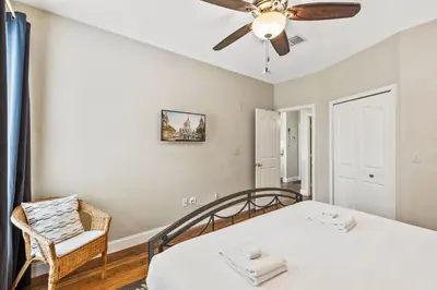 a bedroom with a bed and a ceiling fan at 8805 Dunes Court Unit 5-202 in Kissimmee