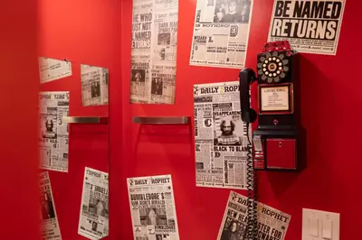 a red door with newspapers and a clock on it at Wizard Themed Suite near Universal and Epic in Orlando