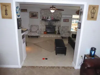 a living room with a couch and a fireplace at Perfecto Mundo 7, Orlando Area 6BR-2MB-3BR Indoor Pool, Ping Pong, Jacuzzi, Disney in Orlando