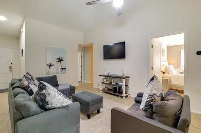 a living room with two couches and a tv at Peaceful Clermont Gem with Pool, 9 Mi to Disney! in Orlando