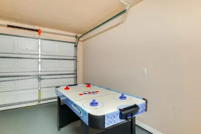 a room with a table in the corner of a room at Peaceful Clermont Gem with Pool, 9 Mi to Disney! in Orlando