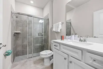 a bathroom with a shower and a toilet and a sink at Brand New 05 Bedrooms At Windsor Cay in Orlando