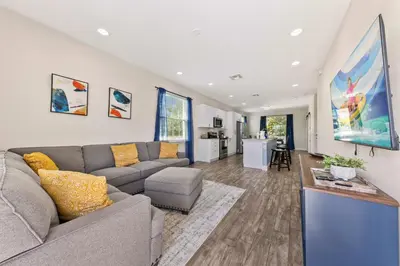 a living room with a couch and a table at 4461 Summer Flowers Pl in Kissimmee