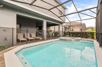a swimming pool in the middle of a house at Lavish Villa W Private Pool And Spa And Free Resort in Orlando