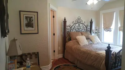 a bedroom with a bed and a window at Kapp and Kappy Bed & Breakfast in Kissimmee