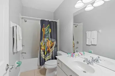 a white bathroom with a sink and a toilet at Apartamento 3 Quartos no Vista Cay Resort in Orlando