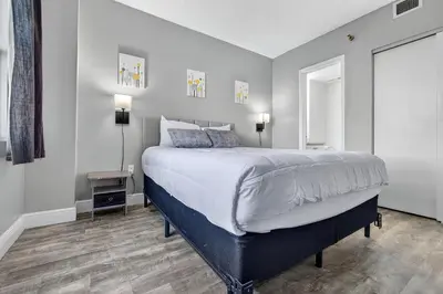 a bedroom with a king sized bed and a window at 6165 CD Unit 3603 - Enclave at Orlando Condo in Orlando