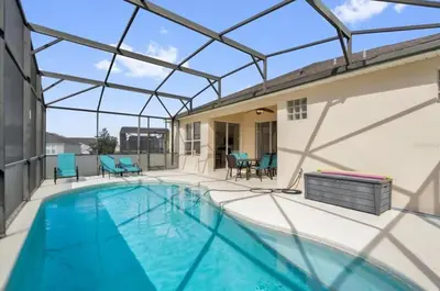 a swimming pool with a glass roof on a house at Mickeys Villa in Kissimmee