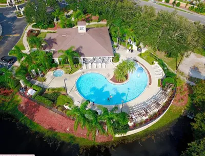 an overhead view of a swimming pool at a resort at Cozy 3 BD Townhome 2 king beds Close to Disney 1503 in Kissimmee