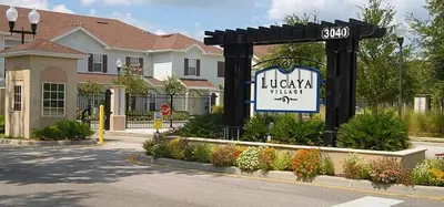 a sign for a hotel in front of a building at Cozy 3 BD Townhome 2 king beds Close to Disney 1503 in Kissimmee