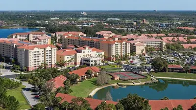 an aerial view of a resort with a body of water at Westgate Town Center Resort in Orlando