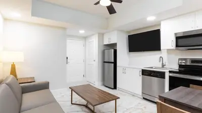 a kitchen with a couch and a table in a room at Westgate Town Center Resort in Orlando