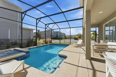 a swimming pool in a house with a glass ceiling at 4350 Storey Lake 17 guests near parks poolspa in Kissimmee