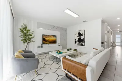 a living room with a couch and a table at 4350 Storey Lake 17 guests near parks poolspa in Kissimmee