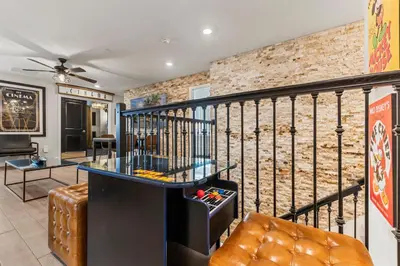 a bar in a room with a brick wall at New Storey Lake Dream Family Escape in Kissimmee