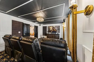 a barbershop with leather chairs in a room at New Storey Lake Dream Family Escape in Kissimmee