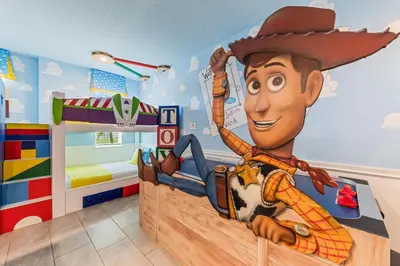 a childs room with a mural of a cowboy at New Storey Lake Dream Family Escape in Kissimmee