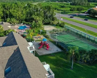 an aerial view of a tennis court with a tennis court at DisneyCondo 10 PP Mr Fredricksen House in Kissimmee