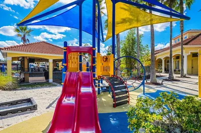 a playground with a slide and a slideintend at 4704 Flagler Beach Way in Kissimmee