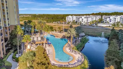 an aerial view of a pool at a resort at 2BR Fireworks View with Pool & Spa 5 Minutes to Disney in Orlando