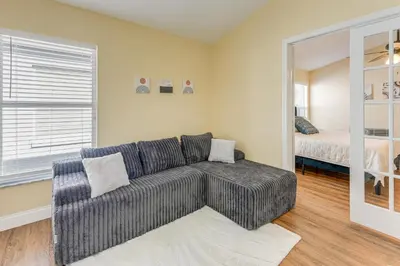 a living room with a couch and a bed at Apopka Family Home with Yard, 13 Mi to Dtwn Orlando in Orlando