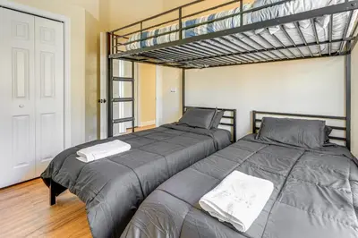 two beds sitting next to each other in a bedroom at Apopka Family Home with Yard, 13 Mi to Dtwn Orlando in Orlando