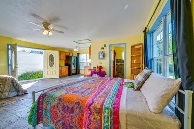a bedroom with a large bed and a large window at 1 Mi to Historic Dtwn Sanford! Pet-Friendly Unit in Sanford