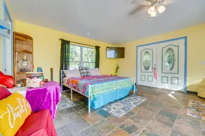 a bedroom with a bed and a couch at 1 Mi to Historic Dtwn Sanford! Pet-Friendly Unit in Sanford