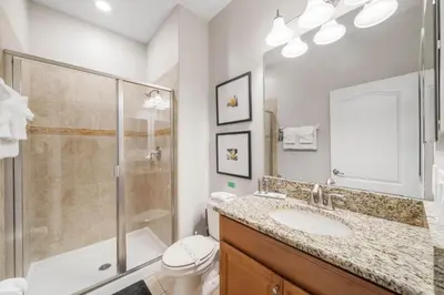 a bathroom with a shower toilet and a sink at Paradise 4Bd w Private Pool & Waterpark 8951 in Kissimmee